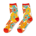 Sheer crew socks featuring a bright yellow, teal, orange, and red floral pattern with solid red cuffs, heels, and toes.