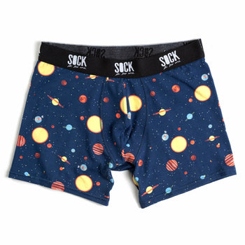 Navy blue men's boxer briefs with a whimsical all-over print of planets and stars in yellow, orange, and red.