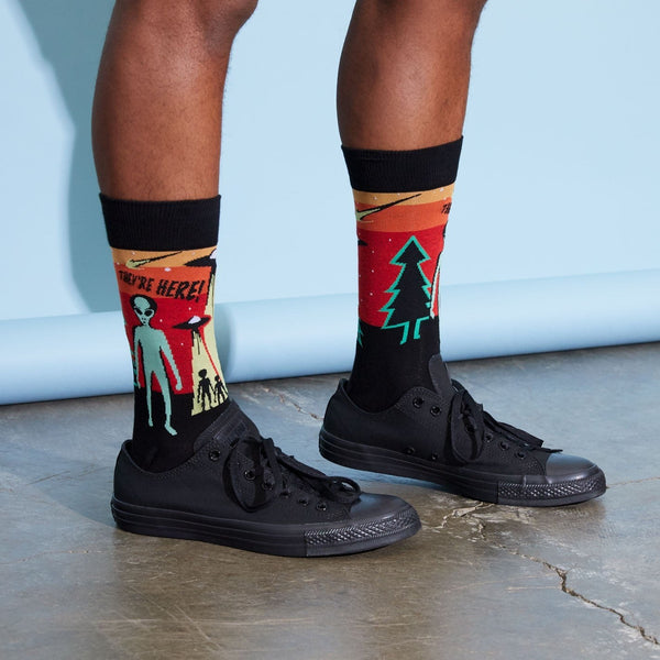 [lf] Model wears black sneakers and socks with alien abduction and forest scenes.