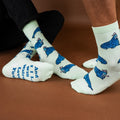 [lf] Two people wear light green socks with blue walrus patterns and a "Walrus Love You" message.