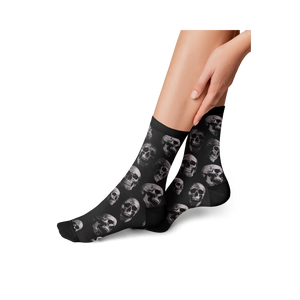 Lifestyle shot: person's legs wearing the skull socks, showing the fit and style.