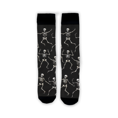 Flatlay image showing a pair of black 'Dead Man's Party' socks with dancing skeletons.