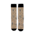 Flatlay image showing a pair of tan 'Dead Man's Party' socks with dancing skeletons.