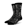 Pair of black crew socks with a fun all-over print of dancing skeletons in off-white.
