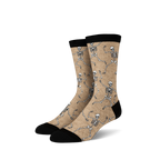 Pair of tan crew socks with a fun all-over print of dancing skeletons in off-white.