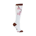White knee-high socks with a brown cuff and a design of a cherry blossom branch with dark pink flowers.