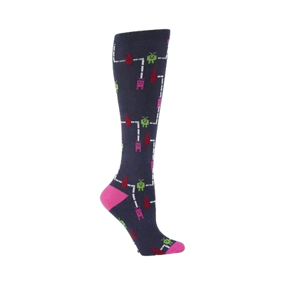 Knee-high socks in navy blue with a pattern of pixelated characters in pink, green, and red, traversing white lines resembling an arcade game.