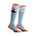 A pair of knee-high socks in light blue, orange, and brown.  One sock shows a flying bonsai tree; the other has a whimsical trail design.