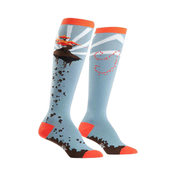 A pair of knee-high socks in light blue, orange, and brown.  One sock shows a flying bonsai tree; the other has a whimsical trail design.