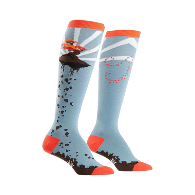 A pair of knee-high socks in light blue, orange, and brown.  One sock shows a flying bonsai tree; the other has a whimsical trail design.