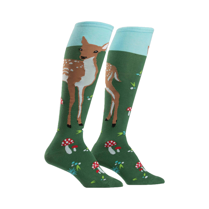 Pair of women's knee-high socks. Green background with illustrations of fawns, mushrooms, and light blue cuff. }}
