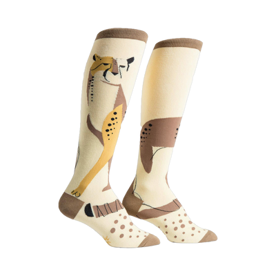 Pair of cream-colored knee-high socks with a stylized cheetah design in brown and gold.  Features brown polka dots and a brown cuff.
