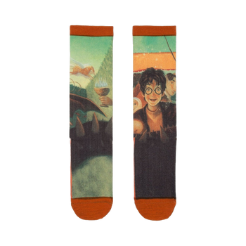 Pair of crew socks showcasing artwork from Harry Potter and the Goblet of Fire. Greens, oranges, and dark tones depict Harry, the Goblet, and other characters.