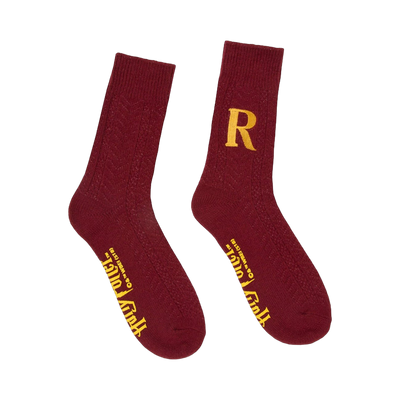 Pair of burgundy crew socks with a gold 'R' and subtle Harry Potter text. Cable knit texture.