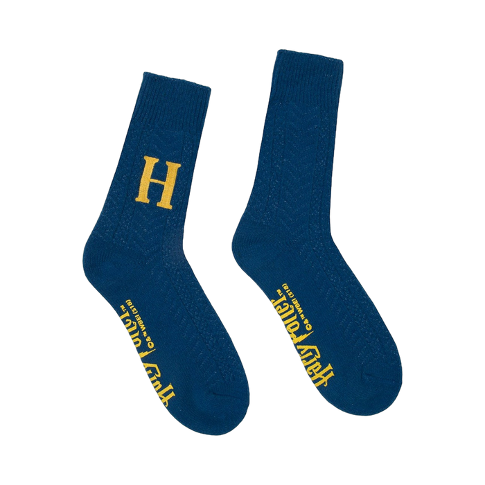 Pair of dark blue crew socks. One sock has a gold 'H', the other has 'Harry Potter' in gold lettering. Subtle textured pattern. }}