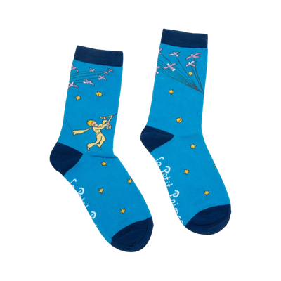 Pair of blue crew socks with navy cuffs.  Features The Little Prince illustration, flock of birds, and gold stars. 