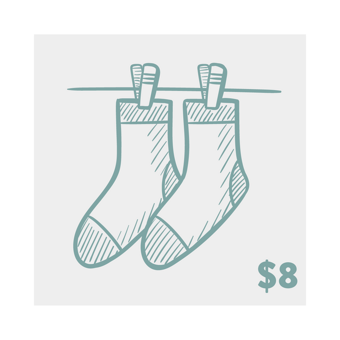 Product shot of two crew socks hanging on a clothesline.  They're a muted teal/purple, with a hand-drawn sketch design.
