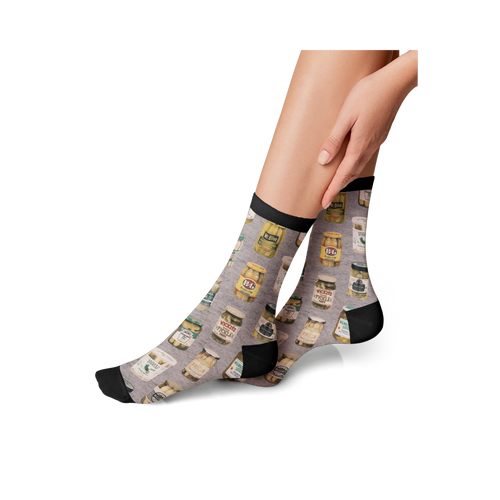 Lifestyle photo showing the Pickle Jars socks on a person's feet.