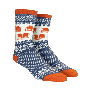 Pair of crew socks in navy blue, white, and burnt orange. Features a Fair Isle pattern with snowflakes and repeating book designs.