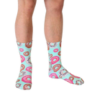 Lifestyle shot of a person wearing the mint green donut crew socks. [lf]