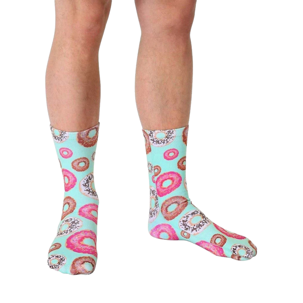 Lifestyle shot of a person wearing the mint green donut crew socks. [lf]
