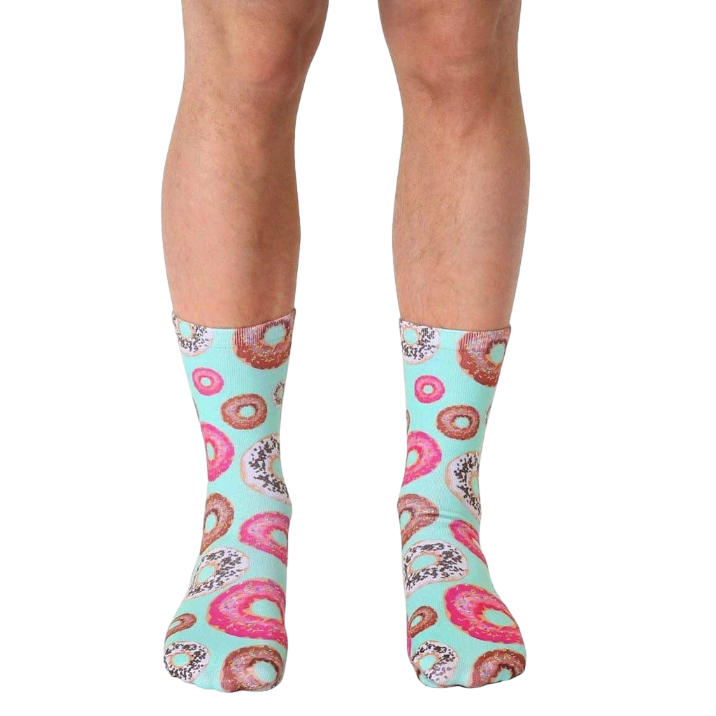 Crew socks in pastel mint green featuring a pattern of pink, brown, and white donuts with sprinkles. [lf]