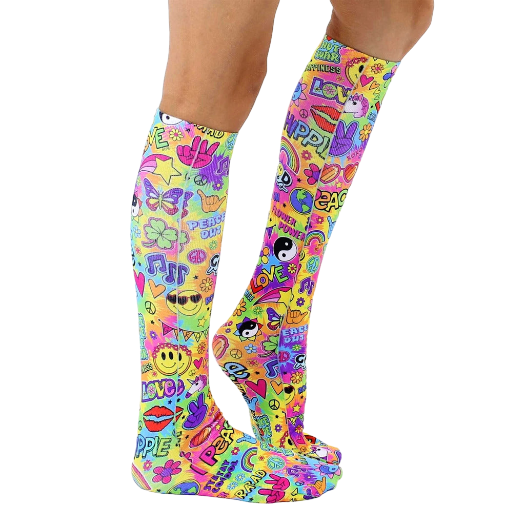Lifestyle shot showing the socks on a person's legs.  The socks are knee-high and feature a colorful, psychedelic design. [lf]