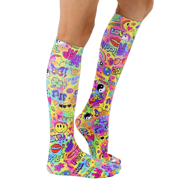 Lifestyle shot showing the socks on a person's legs.  The socks are knee-high and feature a colorful, psychedelic design. [lf]