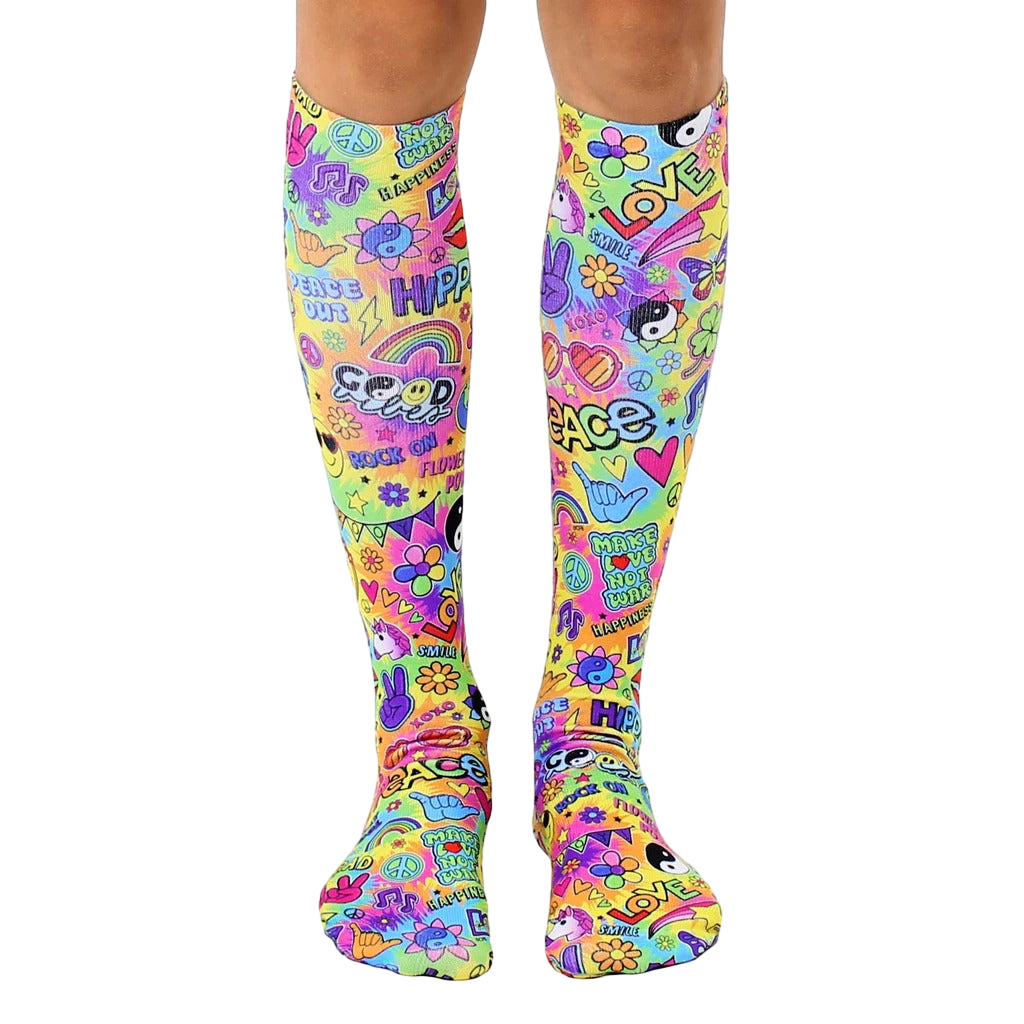 Pair of bright, multicolored knee-high socks with a 70s-inspired design featuring peace signs, smiley faces, rainbows, and the word 'love'. [lf]