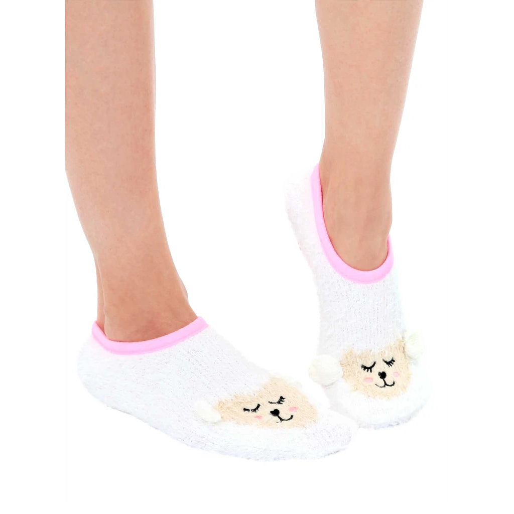 Lifestyle shot showing the fuzzy lamb slipper socks on a person's feet. [lf]