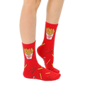 Lifestyle shot of adult and child wearing matching French fry socks. [lf]