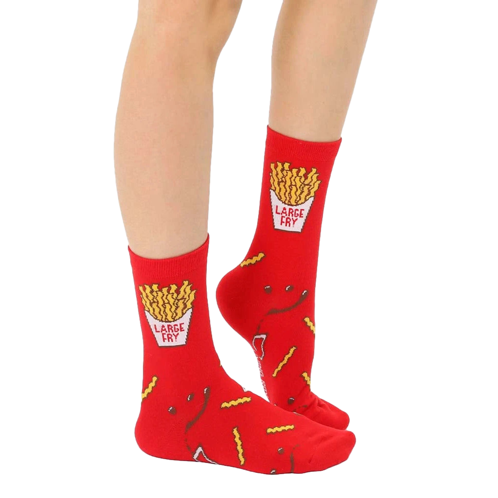 Lifestyle shot of adult and child wearing matching French fry socks. [lf]