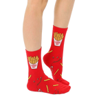 Lifestyle shot of adult and child wearing matching French fry socks. [lf]