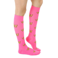 Side view of pink knee-high socks with yellow butterfly pattern worn on a person's leg. [lf]
