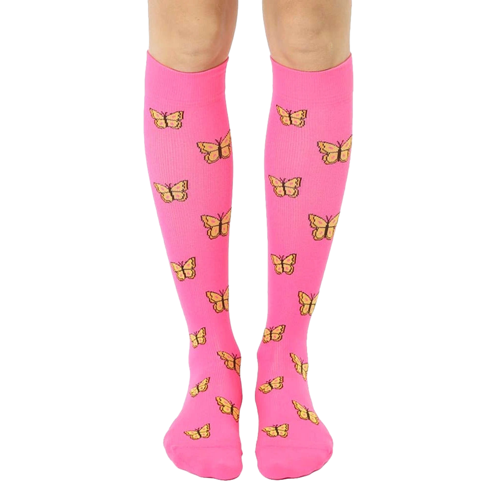 Pair of pink knee-high compression socks with a repeating pattern of small yellow butterflies. [lf]