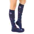 Lifestyle shot showing the Planets Compression socks on a person's legs. [lf]