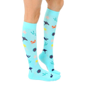 Lifestyle shot showing the Under The Sea Compression socks on a person's legs. [lf]