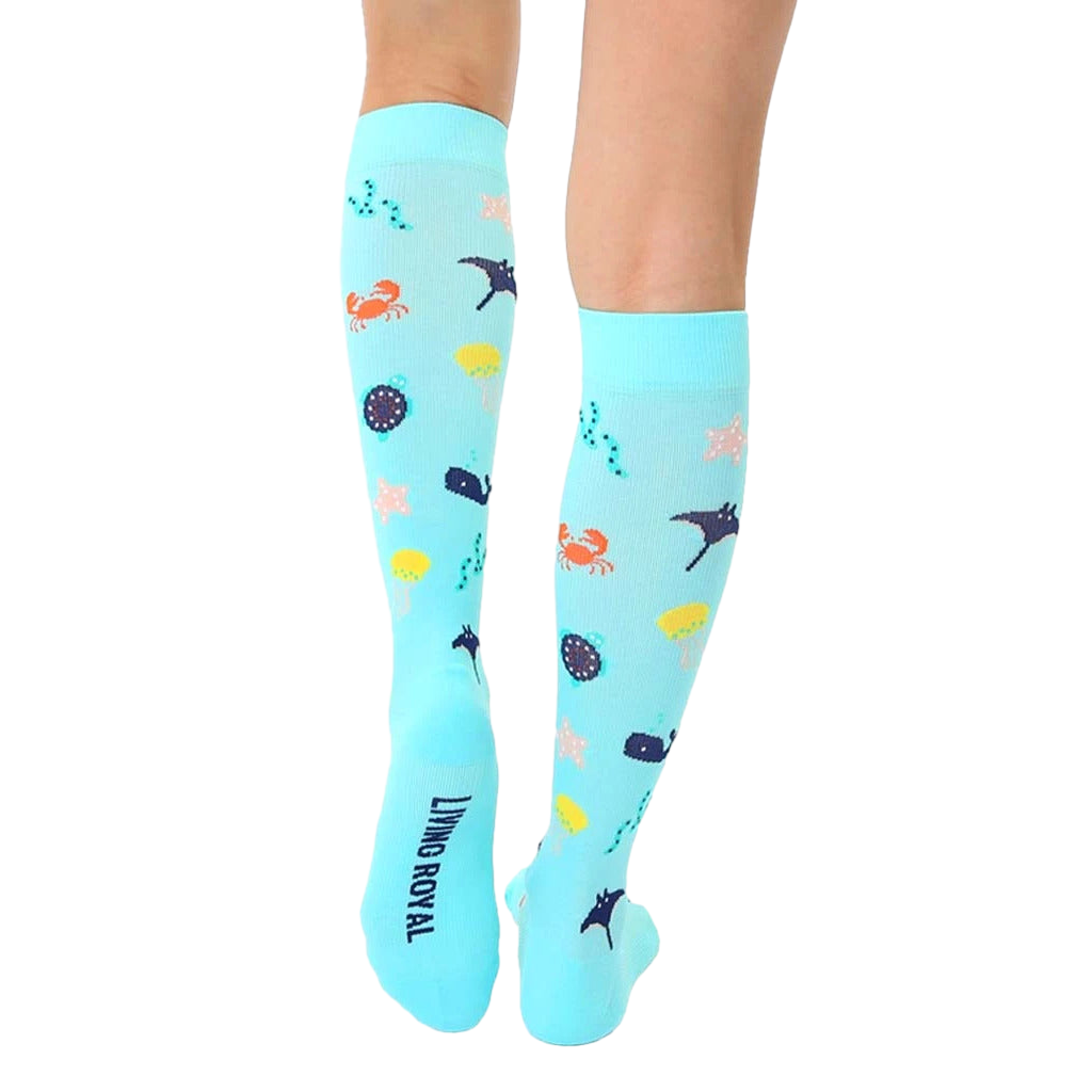 Close-up of the back of the Under The Sea Compression socks, showing the brand logo and the sock's full pattern. [lf]