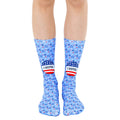 Crew socks in light blue featuring red, white, and blue stars and 'I Voted' stickers. [lf]