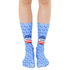 Crew socks in light blue featuring red, white, and blue stars and 'I Voted' stickers. [lf]