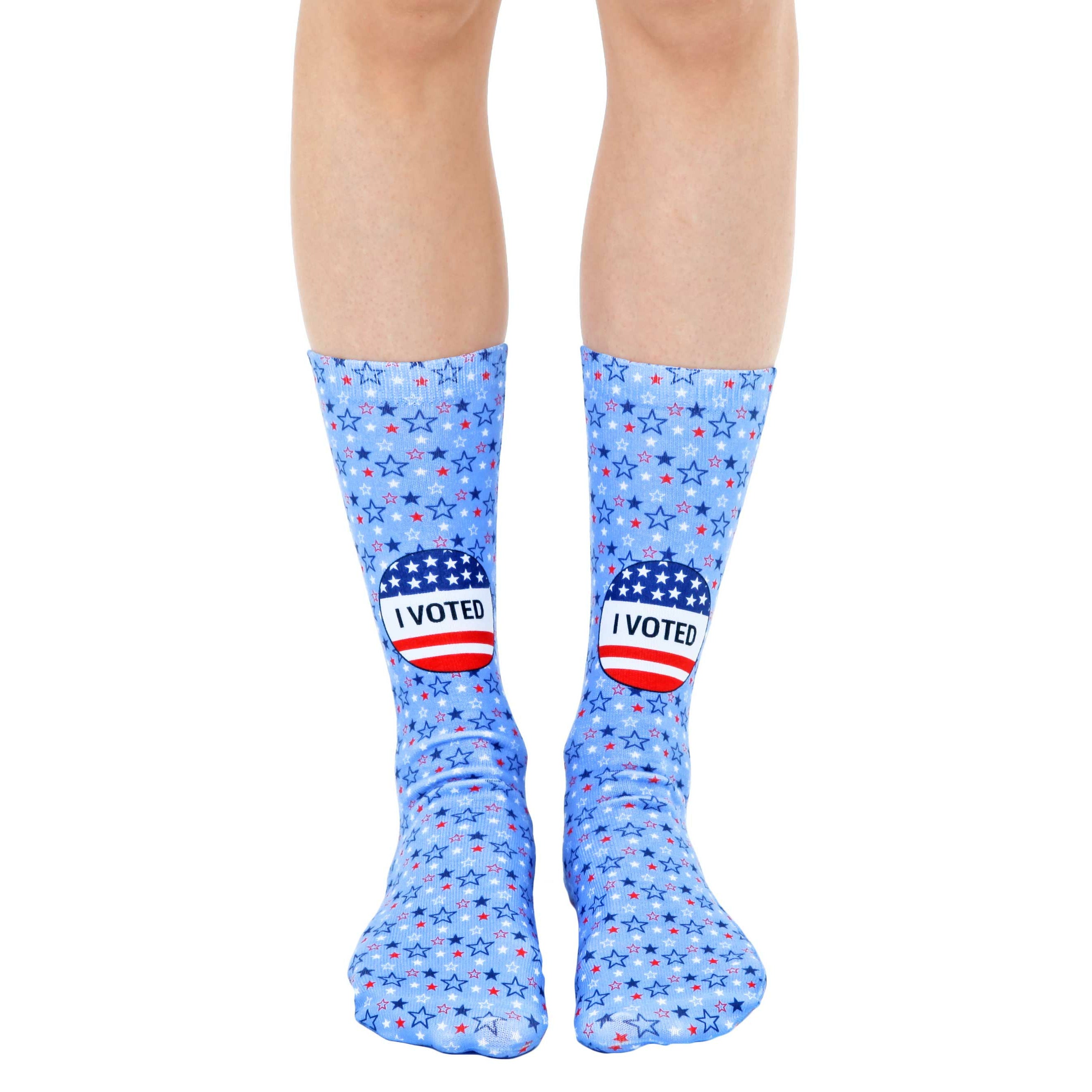 Crew socks in light blue featuring red, white, and blue stars and 'I Voted' stickers. [lf]