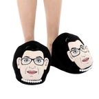 Lifestyle shot: A person's feet wearing the RBG slippers. Shows how the slippers look when worn. [lf]