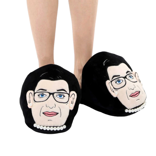 Lifestyle shot: A person's feet wearing the RBG slippers. Shows how the slippers look when worn. [lf]