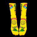Flat lay: Pair of yellow Skate Day socks on a black background. Shows full sock design. [lf]