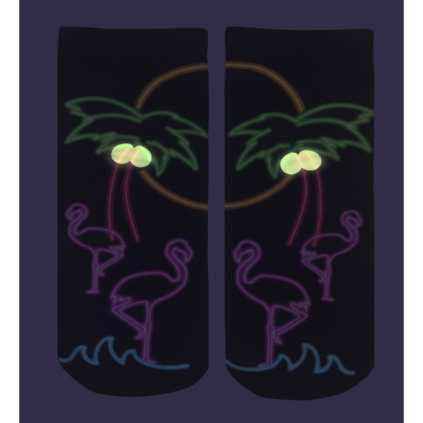 Close-up view of a pair of 'Resort Glow' socks on a dark purple background, highlighting the glow-in-the-dark details. [lf]