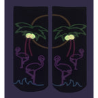 Close-up view of a pair of 'Resort Glow' socks on a dark purple background, highlighting the glow-in-the-dark details. [lf]
