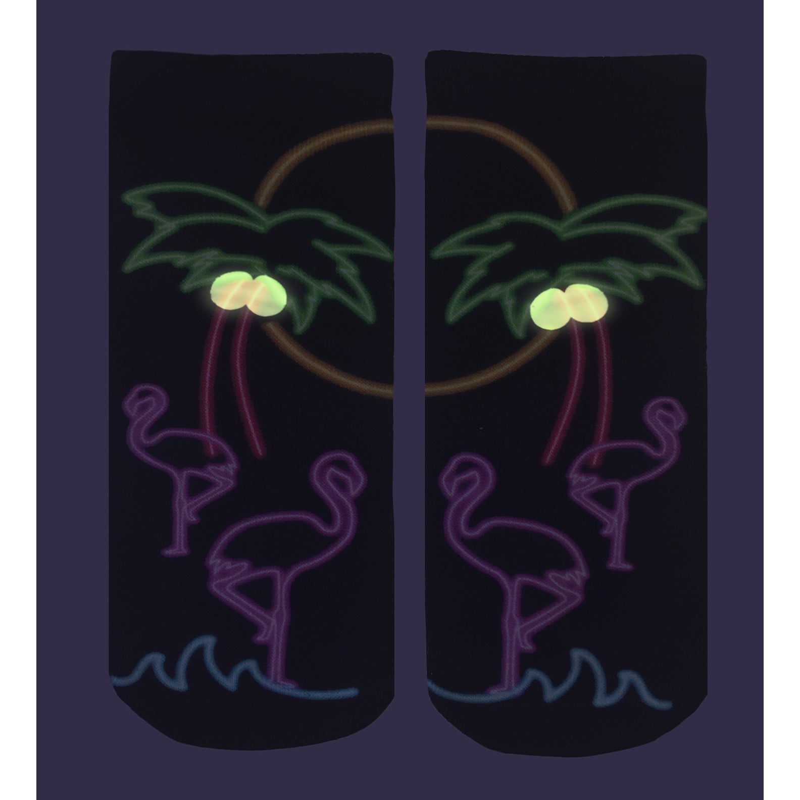 Close-up view of a pair of 'Resort Glow' socks on a dark purple background, highlighting the glow-in-the-dark details. [lf]