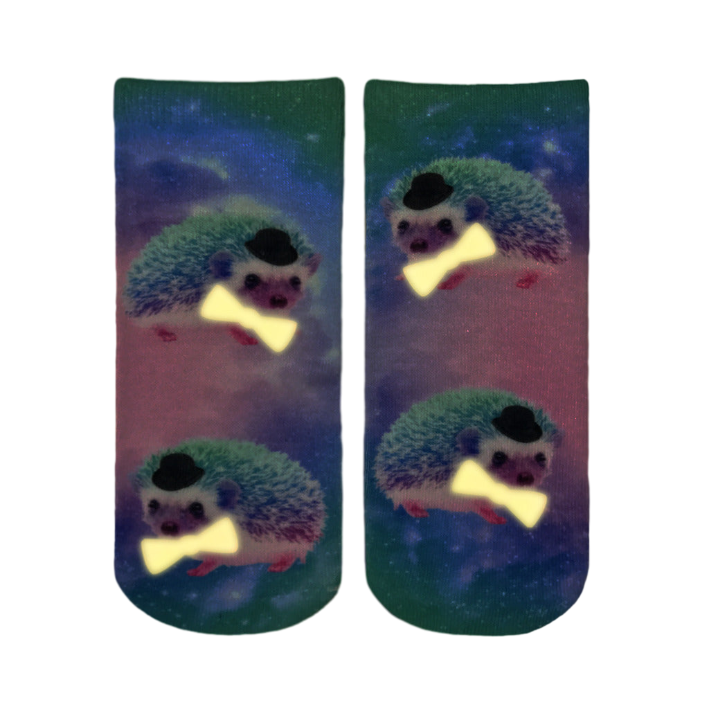 Pair of Hedgehog Glow socks shown against a dark purple background. [lf]