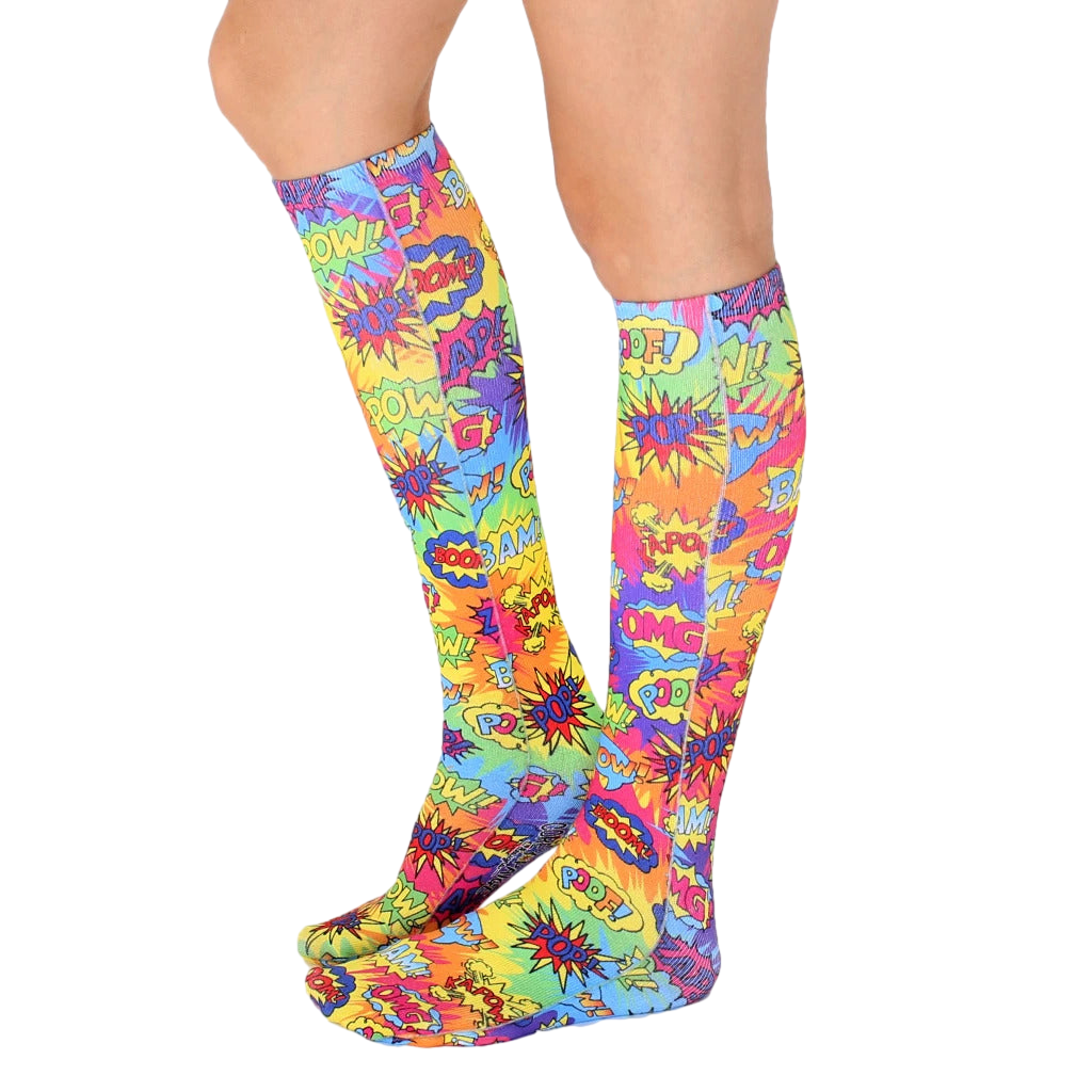Pair of Tie Dye Pop Art knee-high socks shown from the side on a white background. [lf]