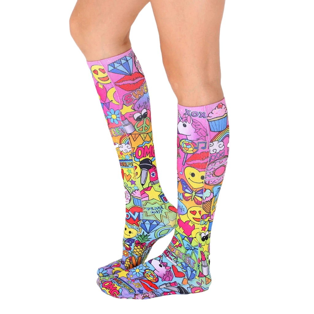 Back view of the knee-high socks, showing the full design. The pink base is covered in colorful graphics. [lf]
